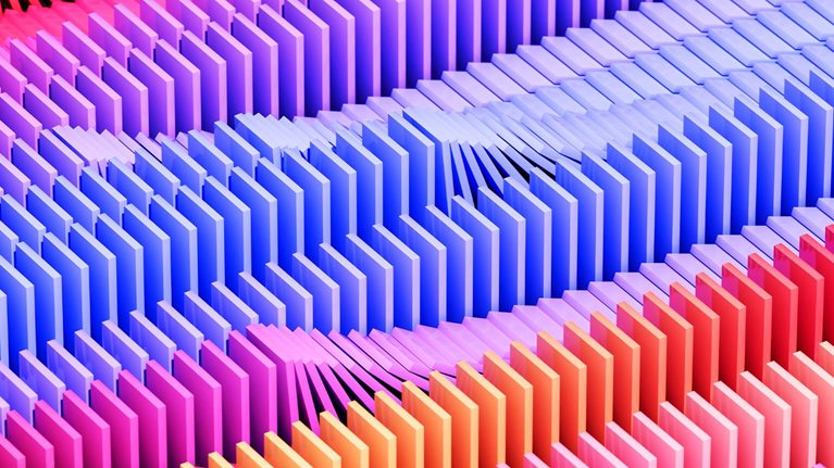 Digital generated image of multicolored dominoes falling over