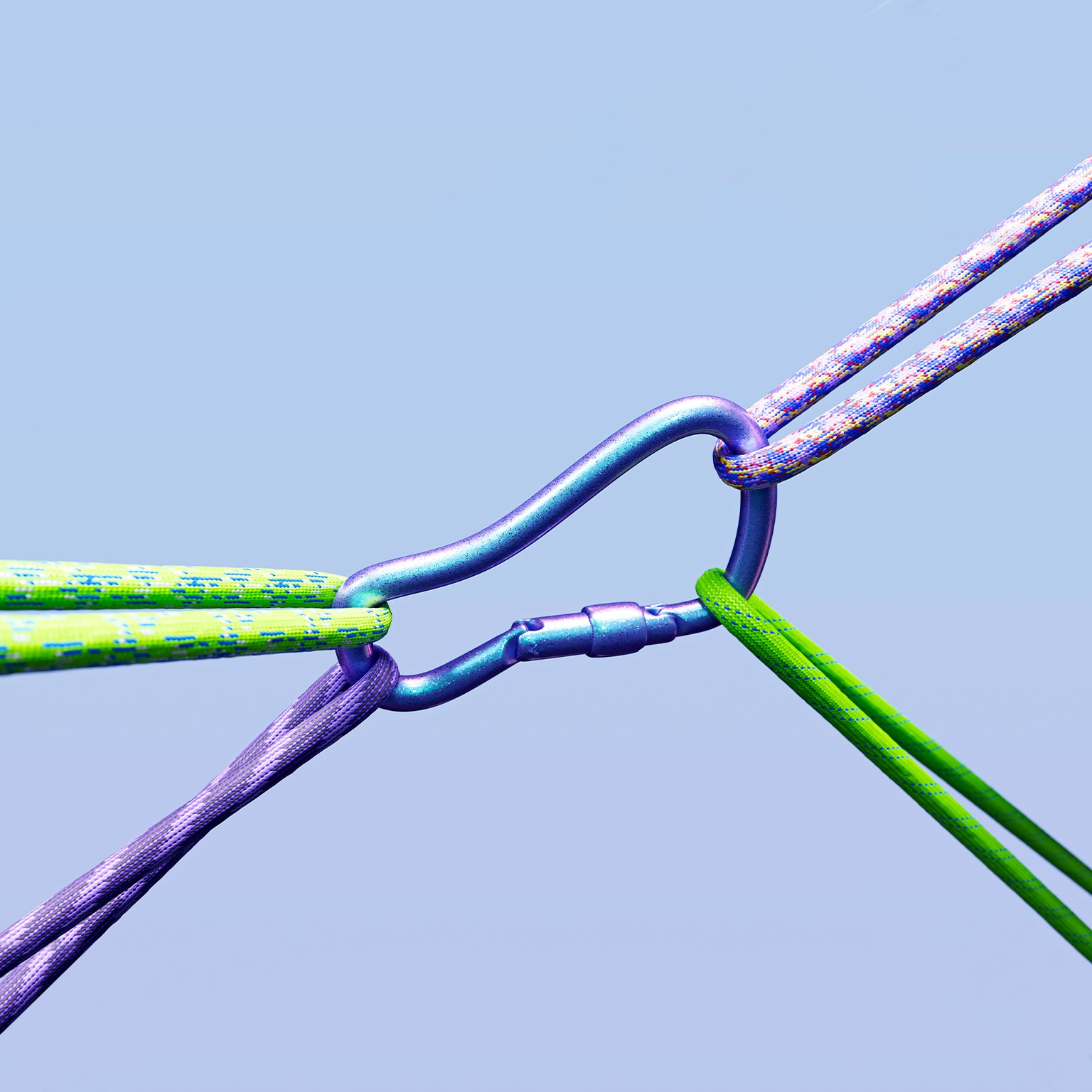 A closeup image of a carabiners being pulled in multiple direction by ropes.