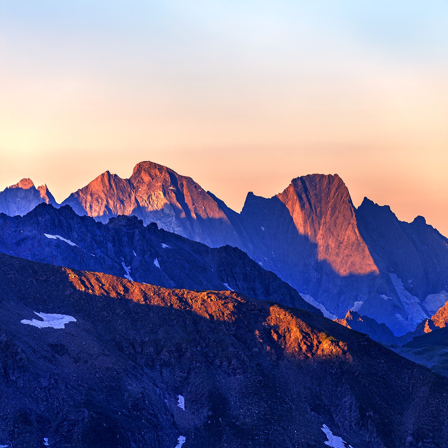 An image of a majestic mountain ridge-line at first light.