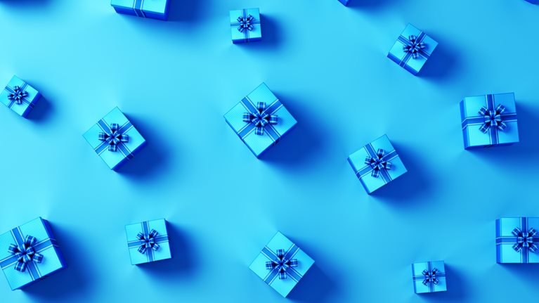 An image of blue gift boxes with blue ribbons.