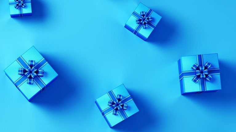 An image of blue gift boxes with blue ribbons.