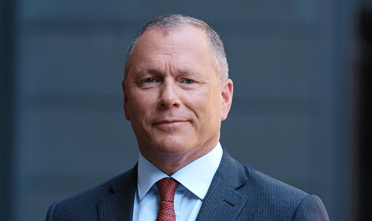 Portrait of Nicolai Tangen with a pensive expression.