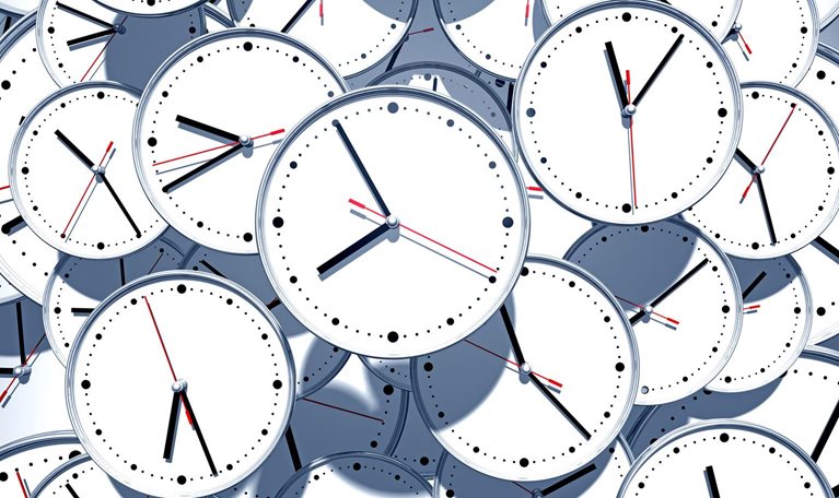 A jumbled pile of clock faces
