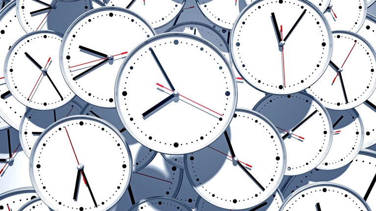 A jumbled pile of clock faces