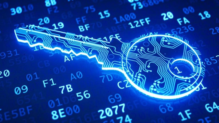 A blue key made to resemble a circuit and placed in front of binary computer code