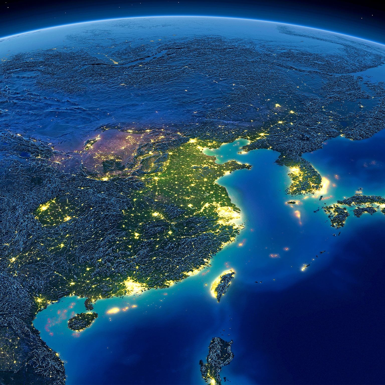 Satellite image of Earth at night with a focus of illumination on Asia