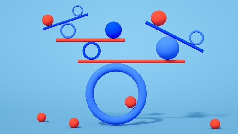 Multiple geometric shapes balancing on a blue background.