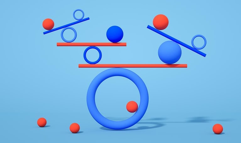 Multiple geometric shapes balancing on a blue background.