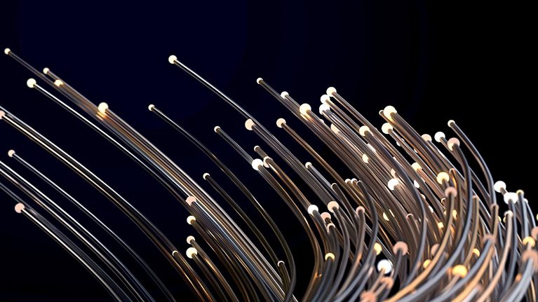 Thin metallic wires of different lengths with small lights at their ends bending together against a dark background for added drama. 
