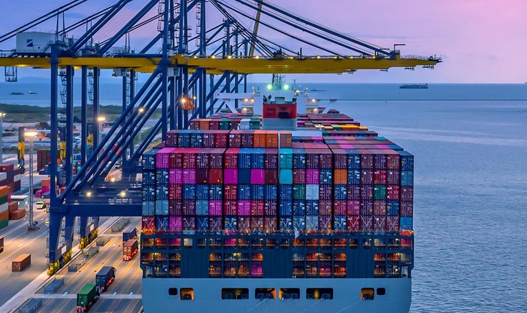 Container ship in seaport at night