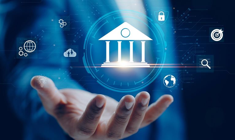A businessperson holds out a hand beneath a digital bank icon surrounded by symbols for data, security, analytics, and connectivity, representing the interconnected digital systems used to create digital twins in banking.