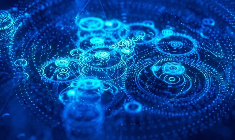 Image of digital light shaped like intricate clockworks.