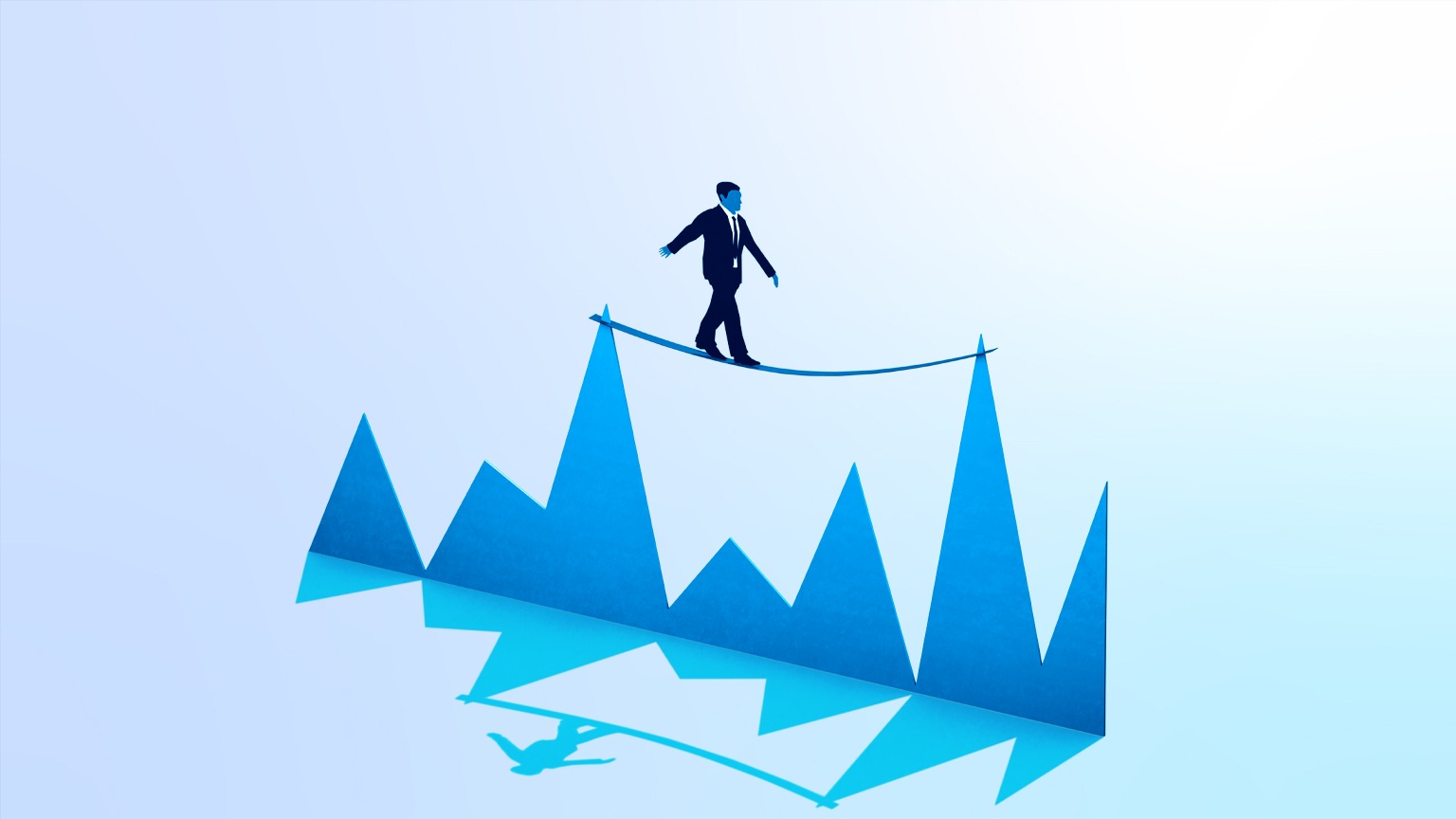 A businessman balancing on a tightrope tied between two peaks of a graph