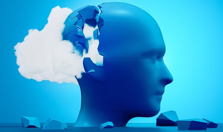 An abstract blue human head cracking open as a cloud spills out, symbolizing the mental fragmentation and strain of cognitive overload.