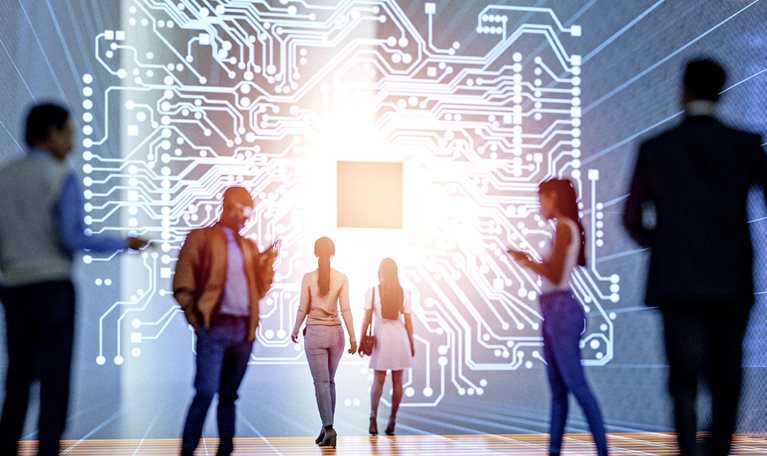 A diverse group of people is shown in a futuristic, digital environment, walking towards a large, glowing graphic of a circuit board.