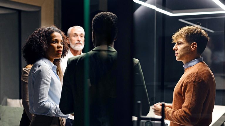 Group of business professionals having a discussion in a private meeting room
