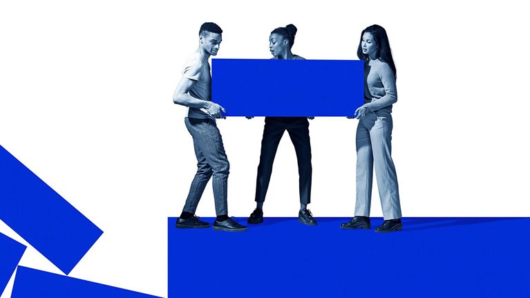 Image of a side view of a woman carrying large electric blue block.