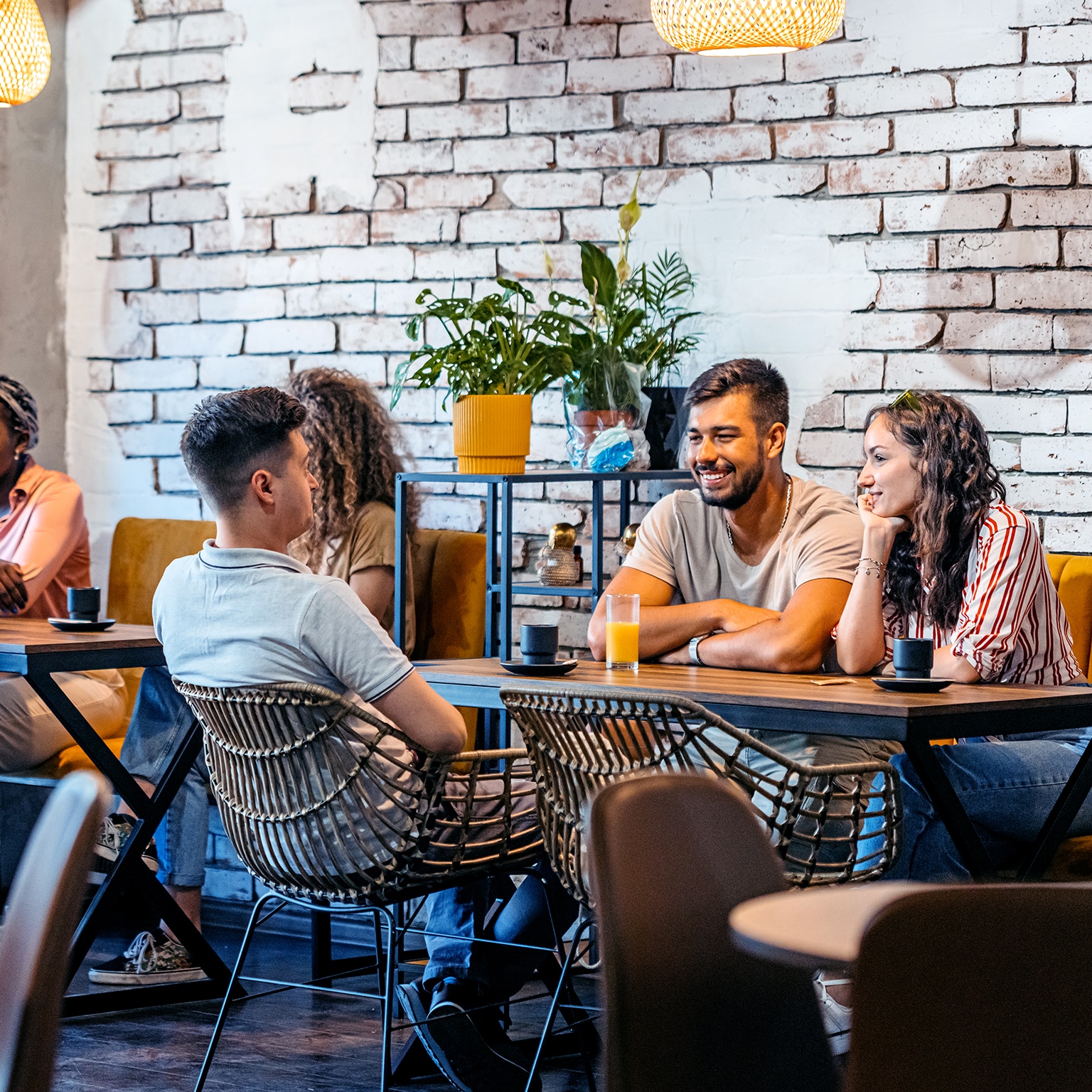Cafe with guests sitting at tables.