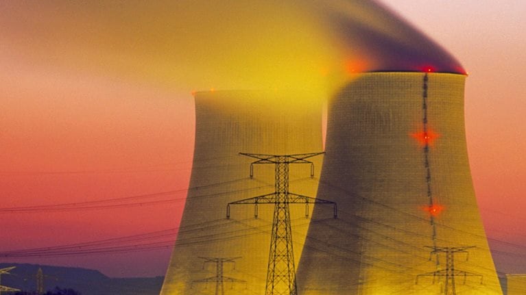 Two nuclear power plant stacks with high power lines at dusk. The sky is a moody purple and red gradient, and the stacks are light with a fluorescent yellow glow.