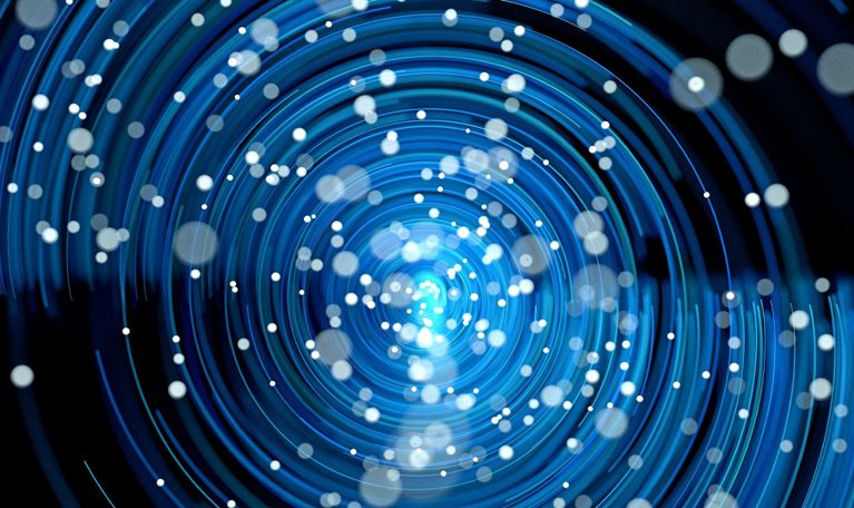 A dynamic, abstract pattern of glowing blue concentric rings spiraling toward a bright center. Small white dots are scattered throughout, resembling particles or stars moving through a vortex-like field.