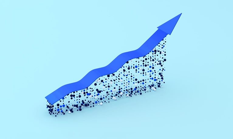 A blue arrow trending upwards symbolizes growth. The arrow appears to be constructed on a foundation of small blue, black, and white spheres, creating a dynamic and textured effect.