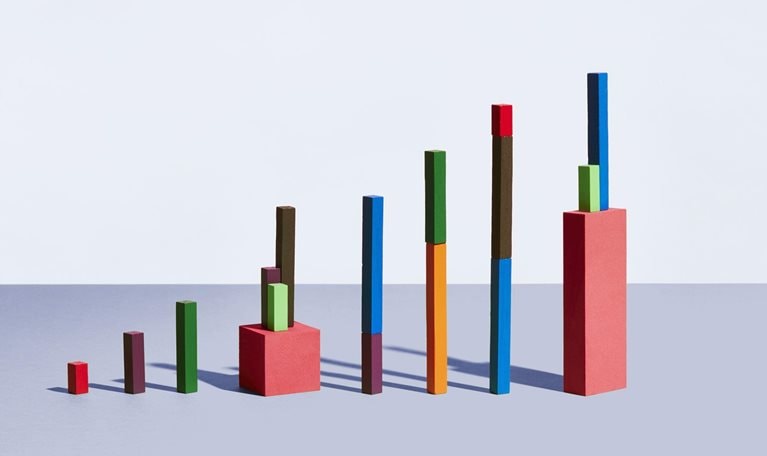 Conceptual image of colorful geometric blocks arranged as a graph.