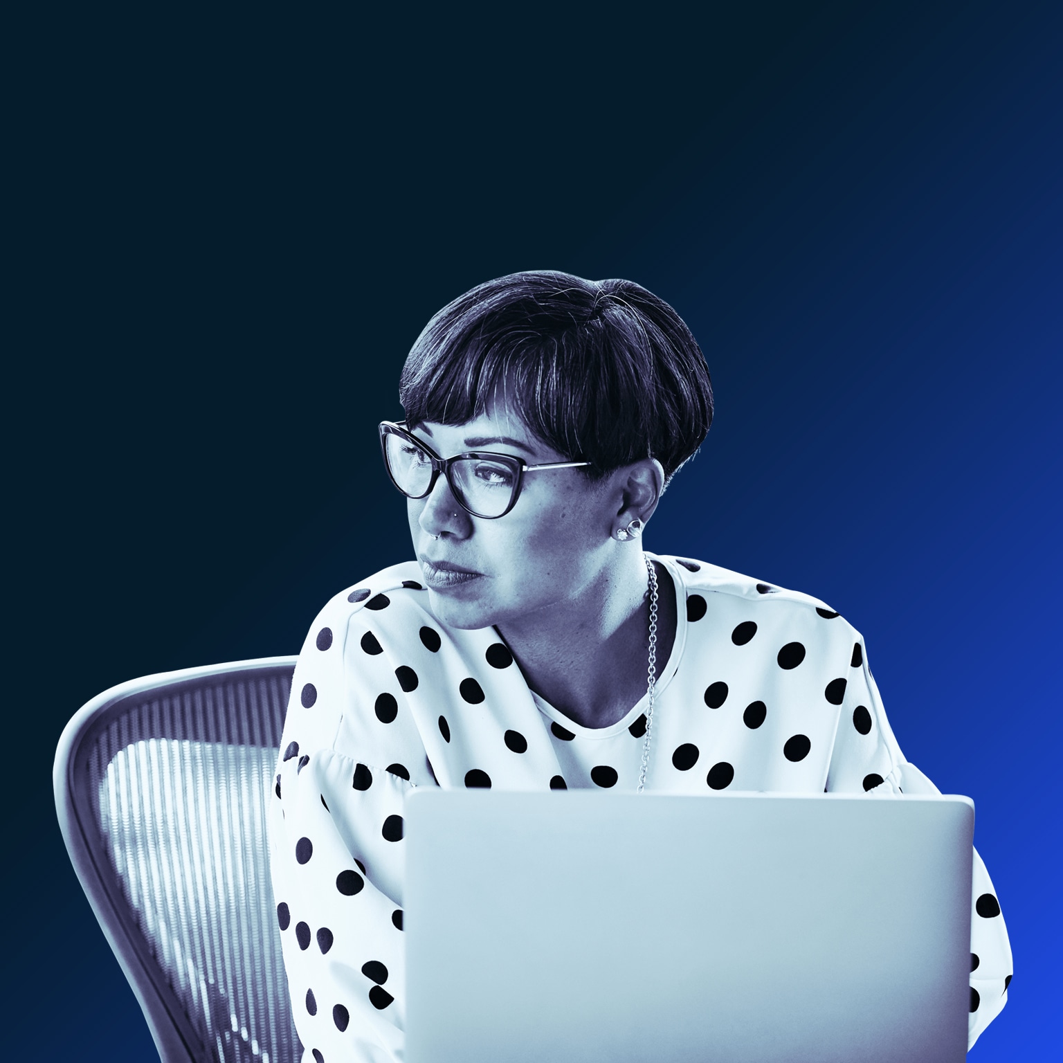 Portrait of businesswoman working on laptop at workstation