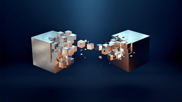 An abstract image of two metallic golden cube formations with smaller cube pieces connecting and transferring between them.
