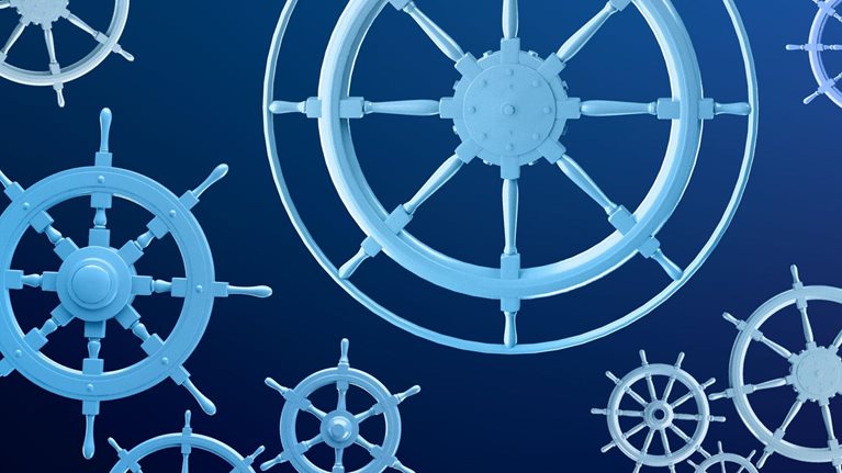 Multiple blue-toned ship wheels