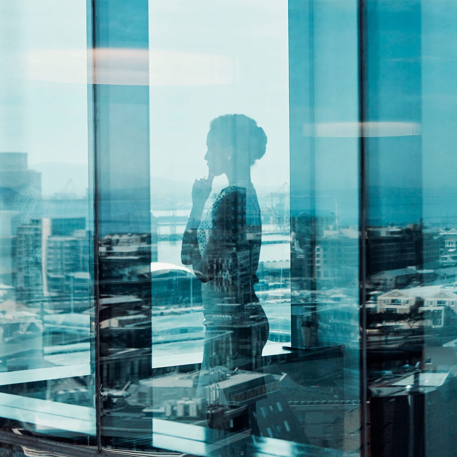 Person looking out office window