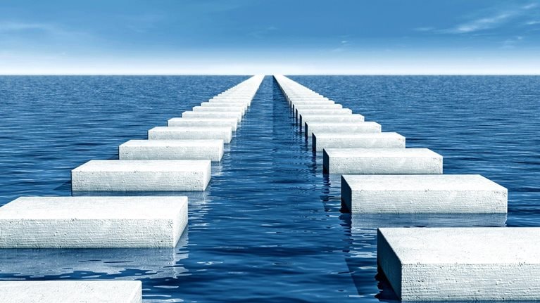 Stepping stones in sea as a symbol for the next step or the way forward