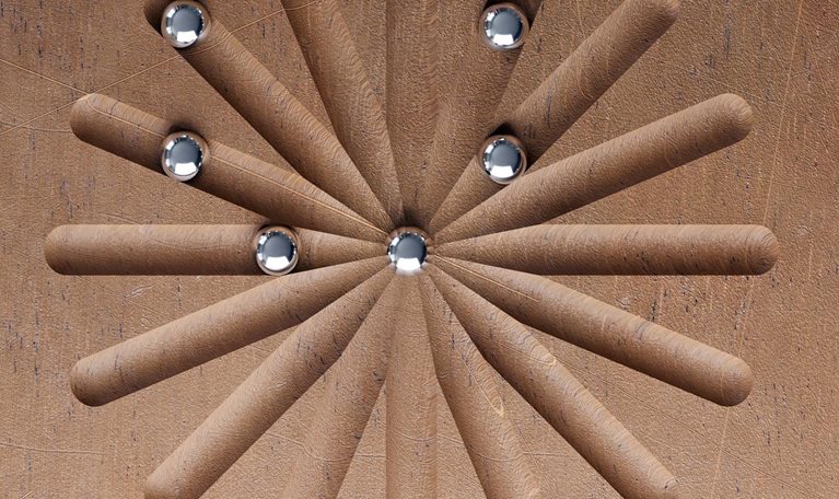 3D render of metal balls roll along wooden pattern. 