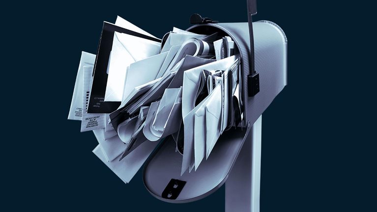 Mailbox stuffed with mail