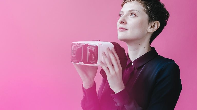 Woman holding VR glasses