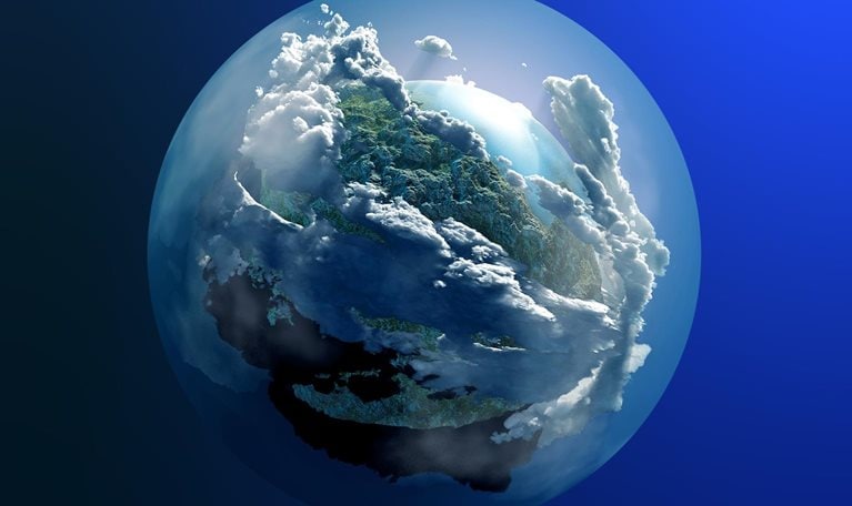 The earth's image with green cover artistically included among clouds covering the globe
