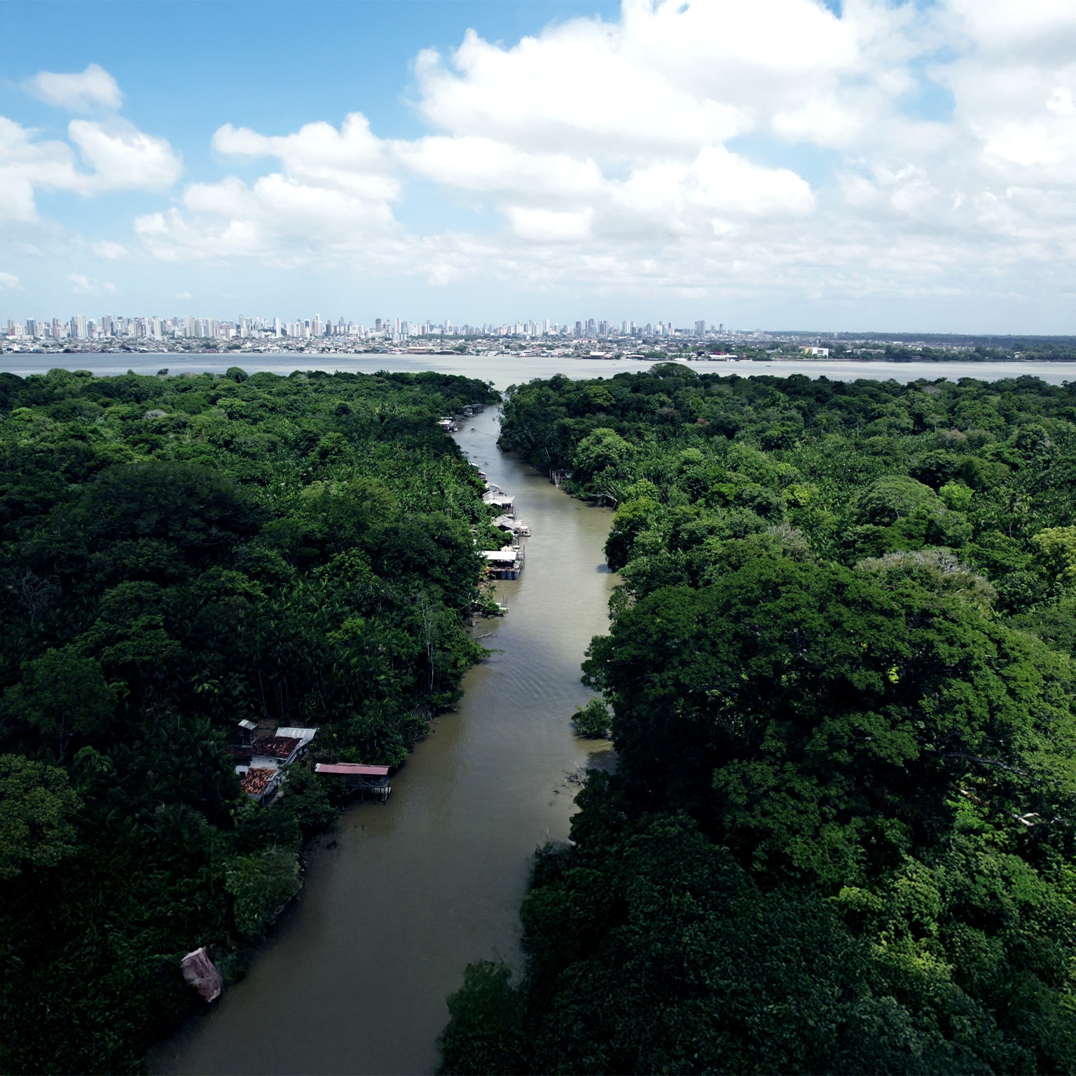 Aerial video that shows a river in the Amazon forest leading to the city of Belem, Brazil.