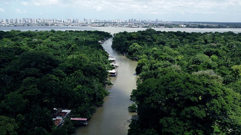 Aerial video that shows a river in the Amazon forest leading to the city of Belem, Brazil.