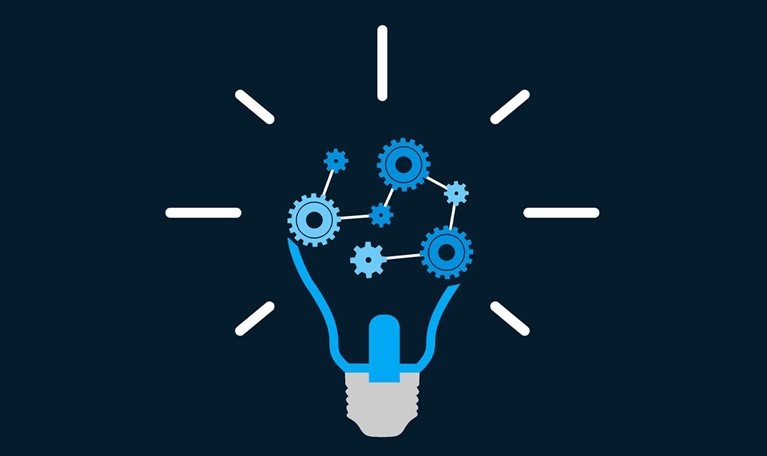 A vector style illustration of a light bulb with interconnected gears inside. The image is rendered in shade of cyan and set against a dark blue background.