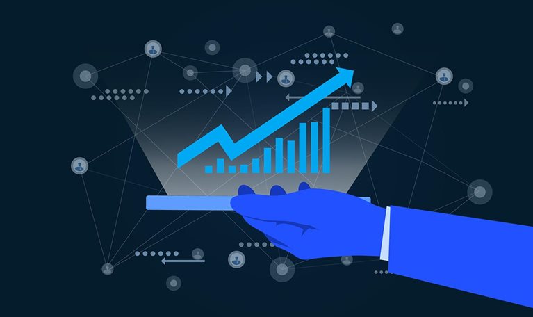 A flat-style digital illustration shows a blue-sleeved hand holding a phone or tablet that projects a glowing hologram of a rising cyan bar chart and an upward-trending arrow. Around the projection, a faint web of connected lines links small circular icons of people, with dotted lines and arrows suggesting flows of data, all set against a deep blue background. End of image description.