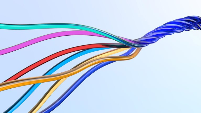 Image of multicolored wires twisting together.