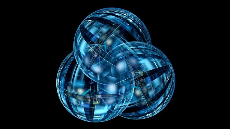 Three overlapping translucent blue spheres with intricate intersecting lines and geometric patterns appear against a black background.