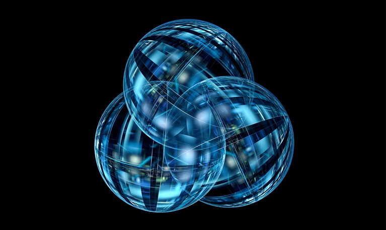 Three overlapping translucent blue spheres with intricate intersecting lines and geometric patterns appear against a black background.