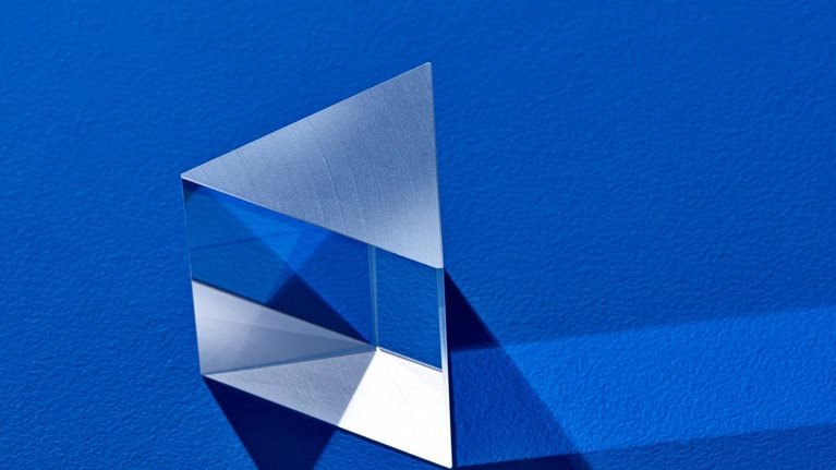 Triangular prism refracting light beam