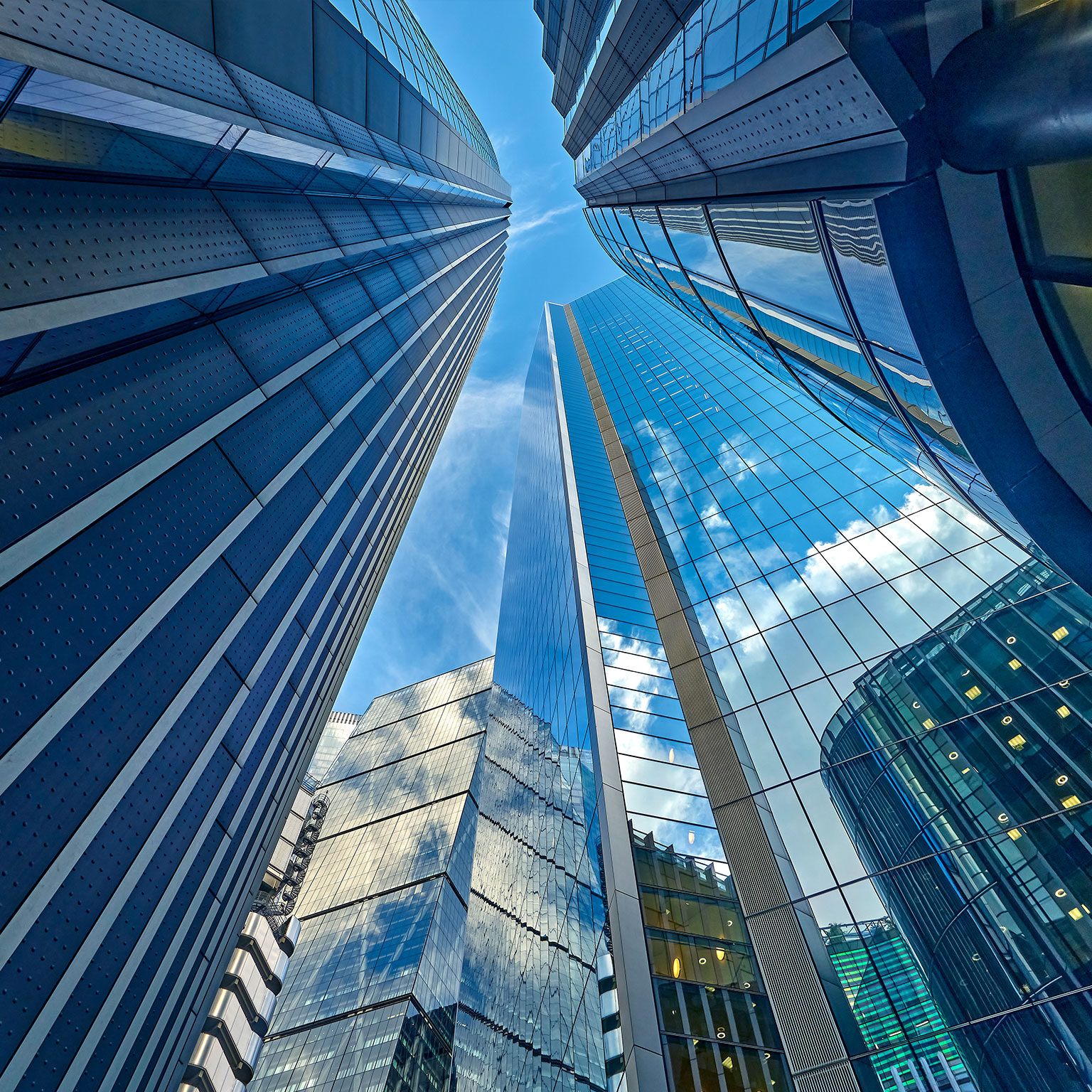 Low angle view looking directly up from the street at buildings in London