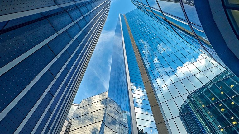 Low angle view looking directly up from the street at buildings in London