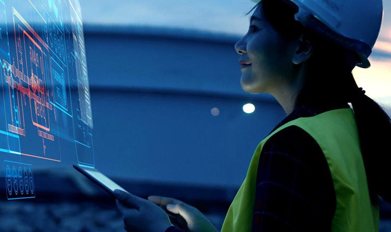 Female Engineer Using AI Digital Dashboard for Smart Factory Monitoring and Industrial Automation