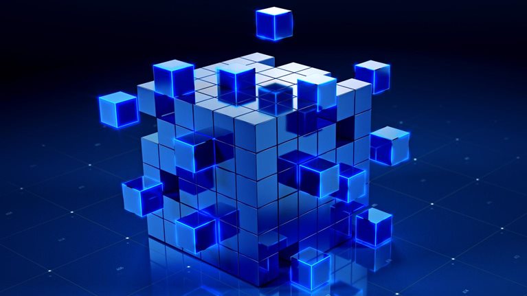Abstract 3D image of a large cube assembled from smaller blue cubes, with several glowing cubes floating around it above a dark blue grid surface.