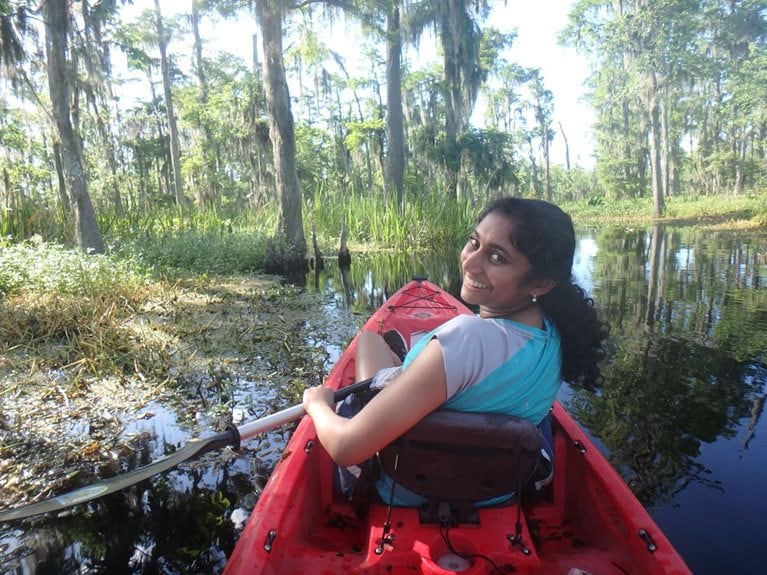 Anika kayaking in swamp
