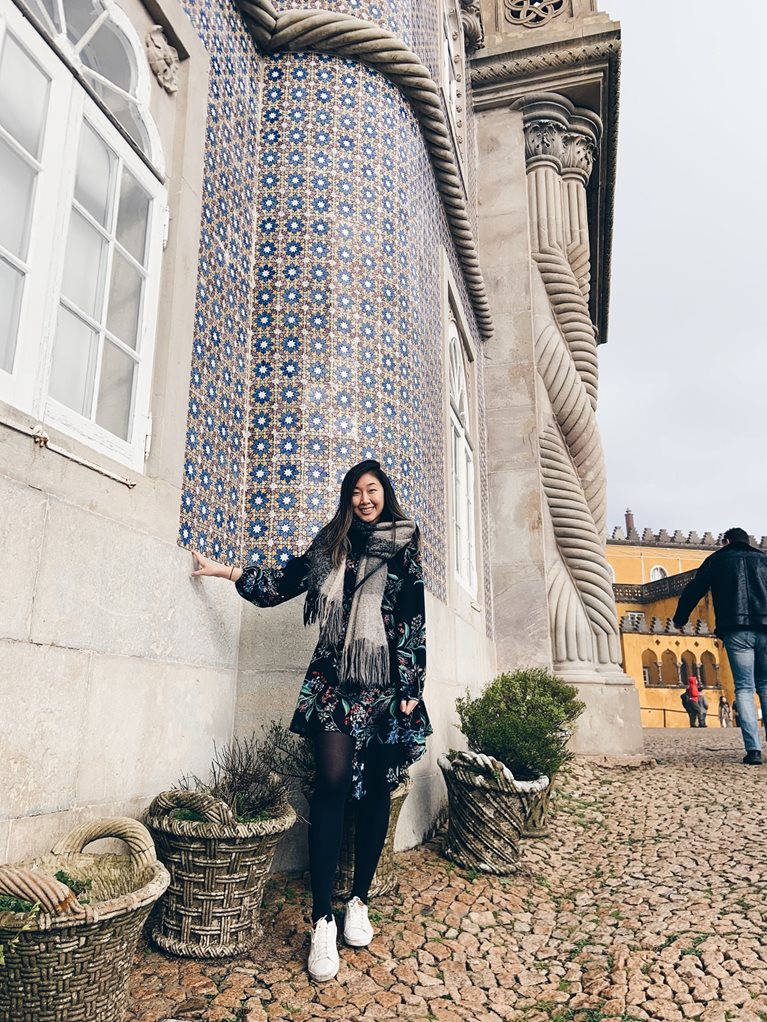 Anna in front of cool blue tile