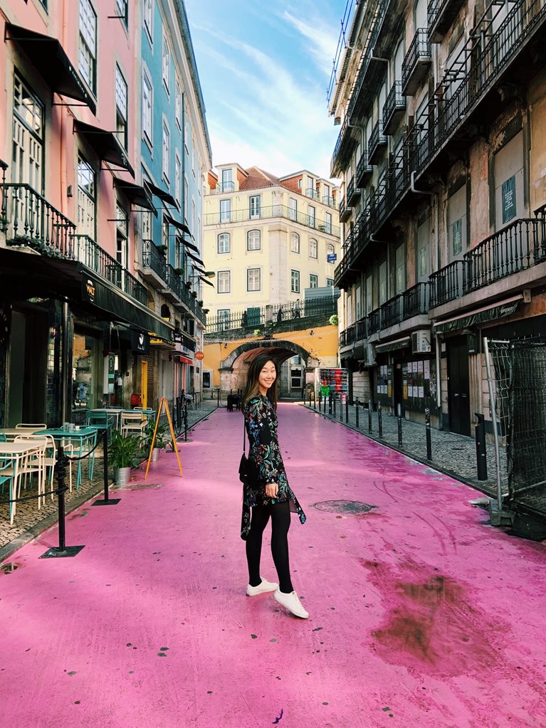 Anna walking on pink street